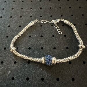 Silver Braided Bracelet with Blue Crystal Accent